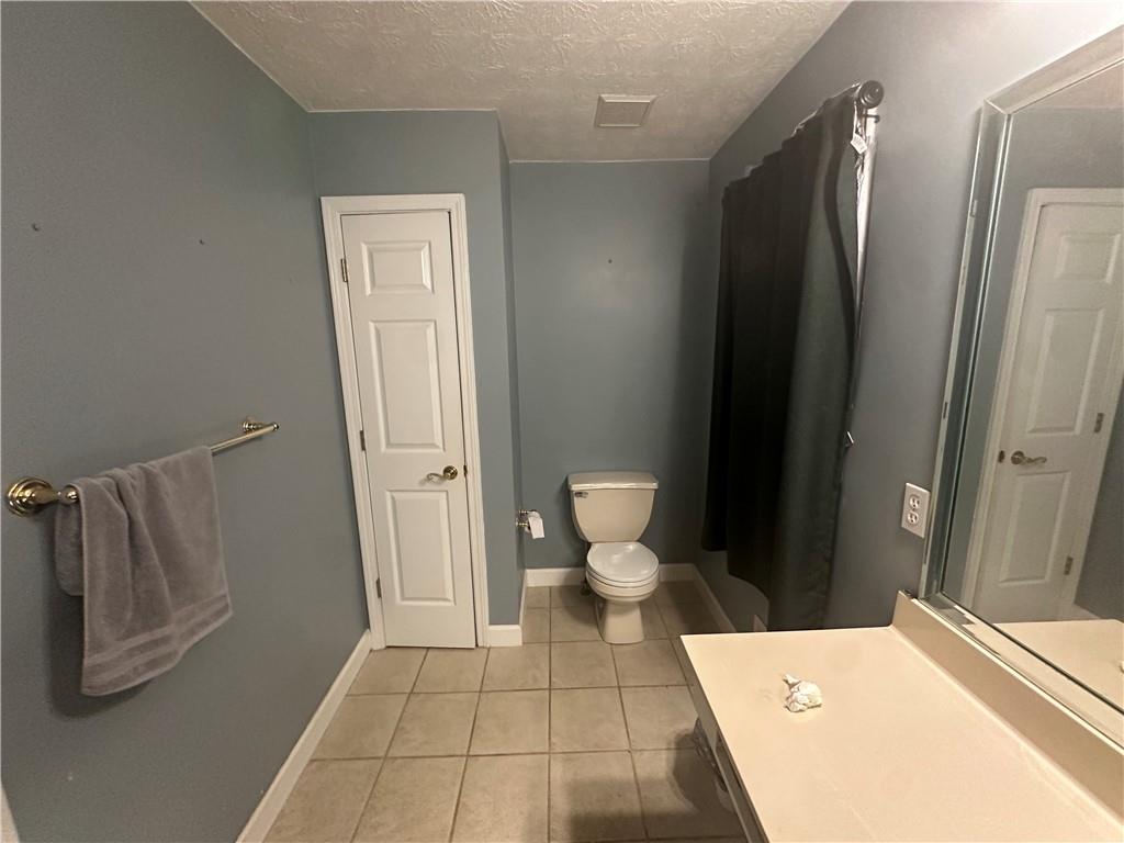 34 Deer Trail Stockbridge, GA 30281 - Photo 20 of 44 a bathroom with a toilet and a shower
