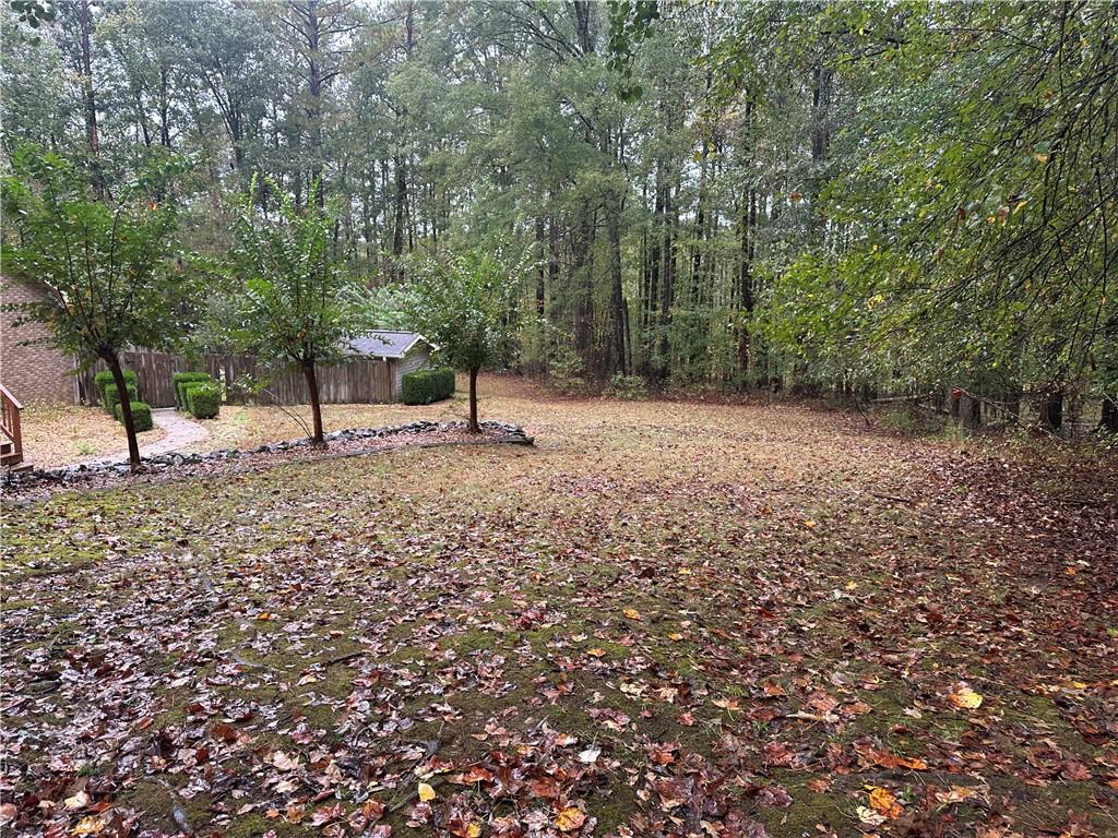 34 Deer Trail Stockbridge, GA 30281 - Photo 26 of 44 a view of a forest with trees in the background