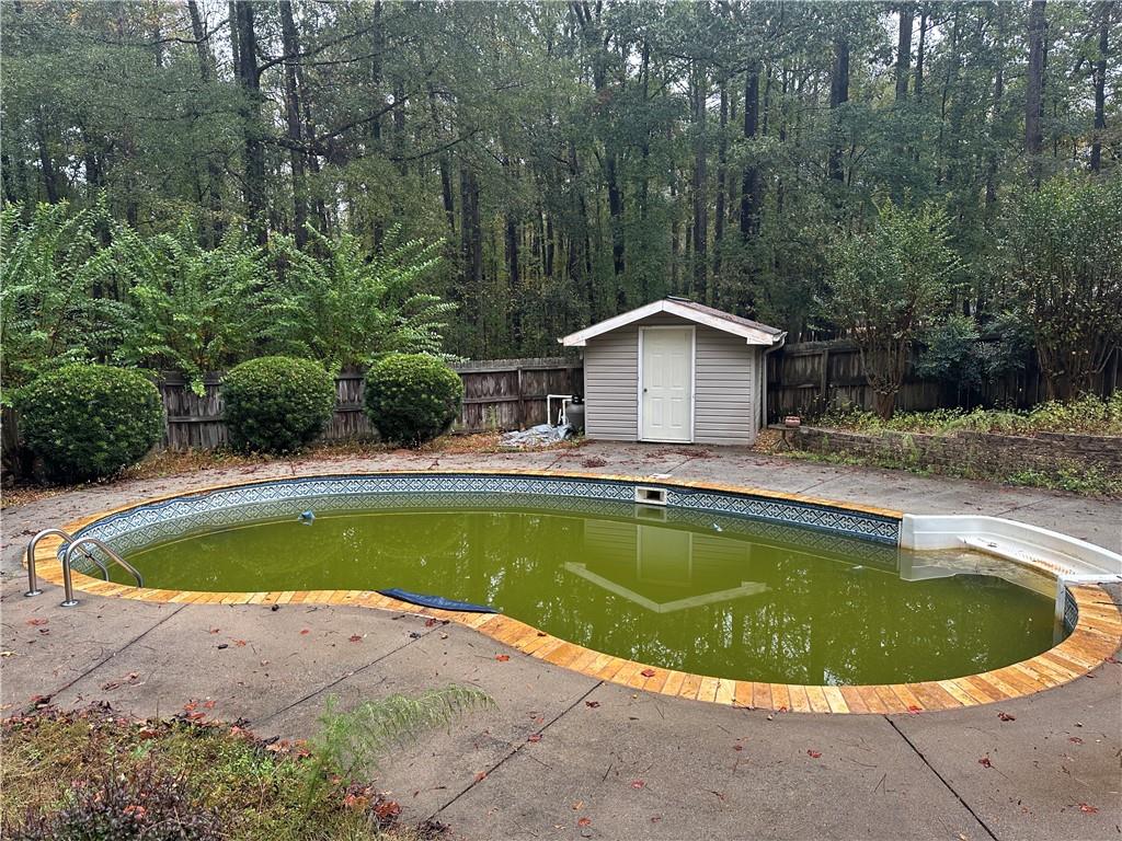 34 Deer Trail Stockbridge, GA 30281 - Photo 28 of 44 a view of a swimming pool and a yard