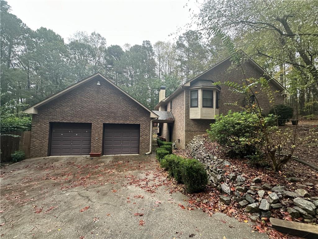 34 Deer Trail Stockbridge, GA 30281 - Photo 31 of 44 a front view of a house with a garden