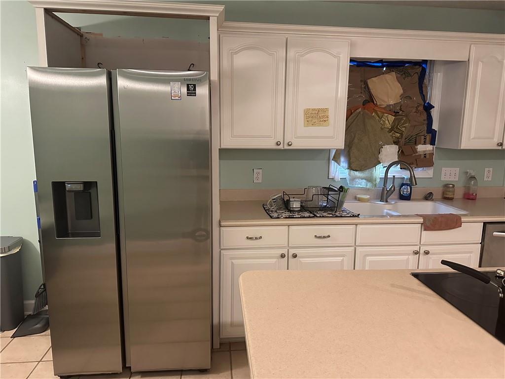 34 Deer Trail Stockbridge, GA 30281 - Photo 4 of 44 a kitchen with a refrigerator sink and cabinets