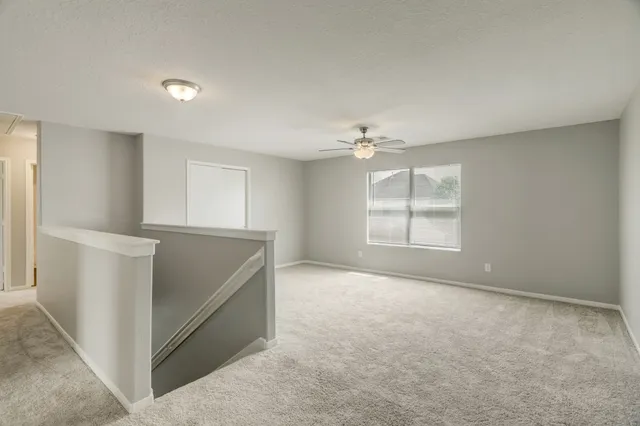 a view of an empty room with windows