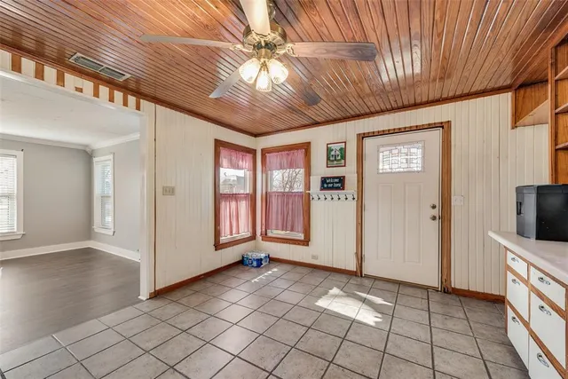 a view of a livingroom with an empty space and a window