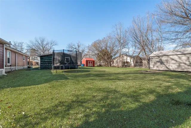 a view of a field with tree