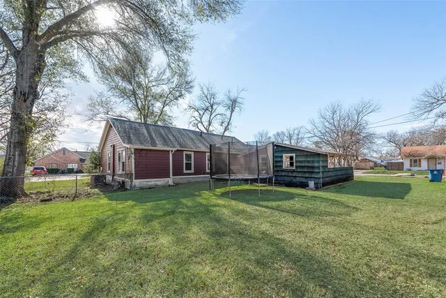a house view with a sitting space and garden