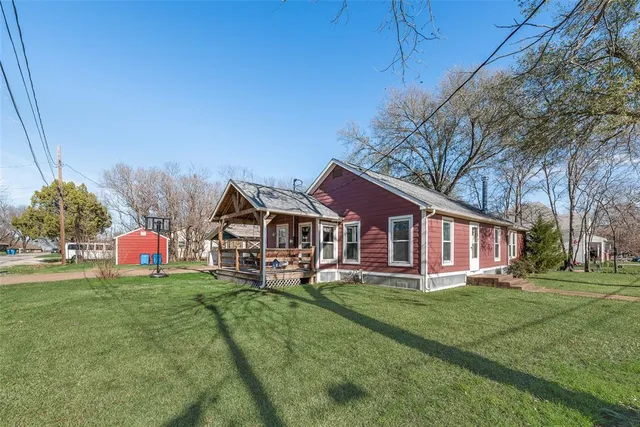 a view of a house with a big yard