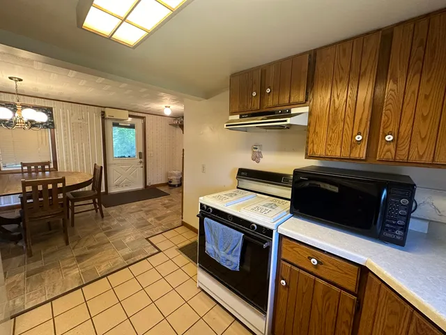 a kitchen with a stove and a refrigerator