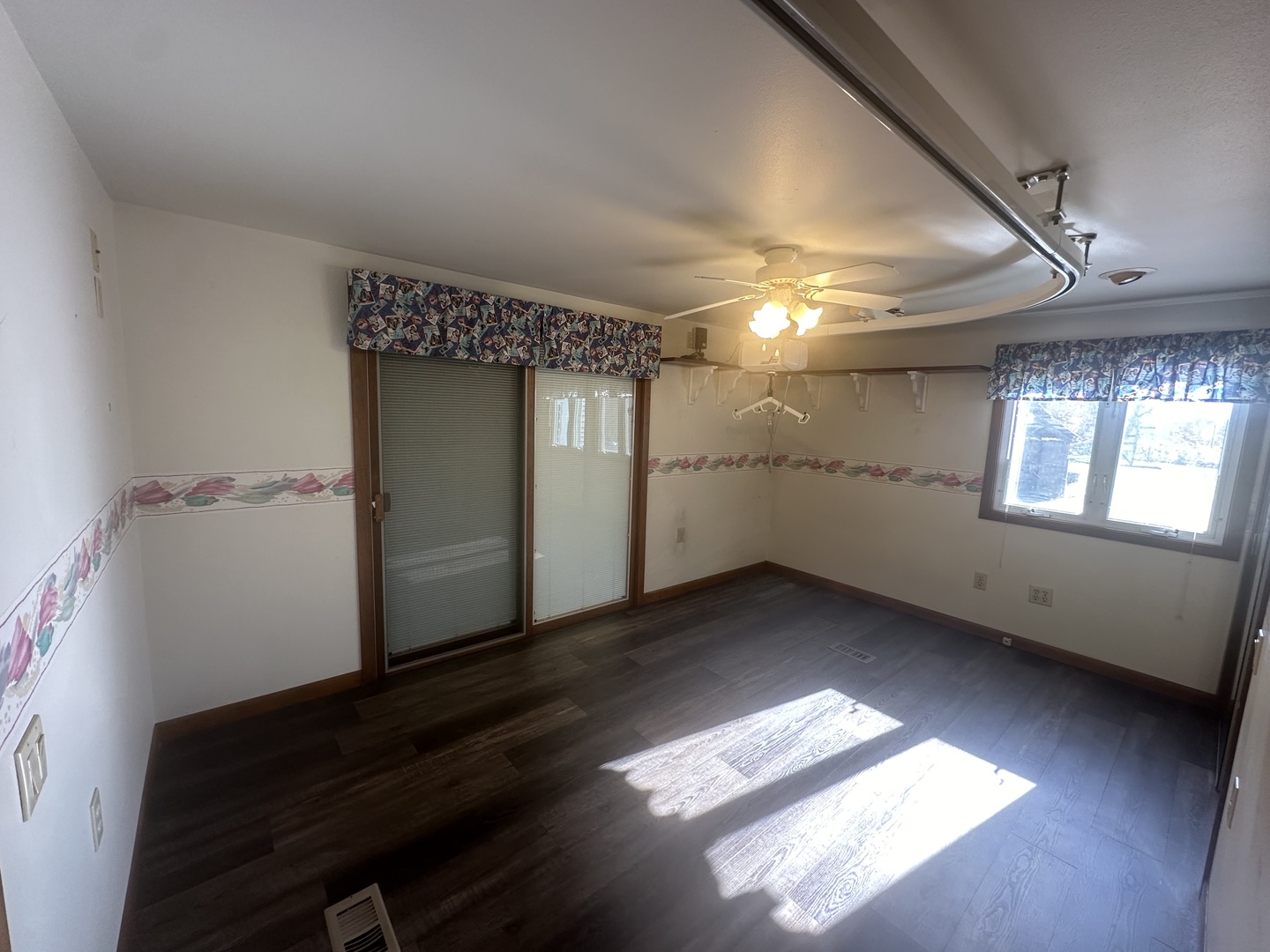 13629 Garden Plain Road Morrison, IL 61270 - Photo 22 of 28 a view of empty room with wooden floor and fan