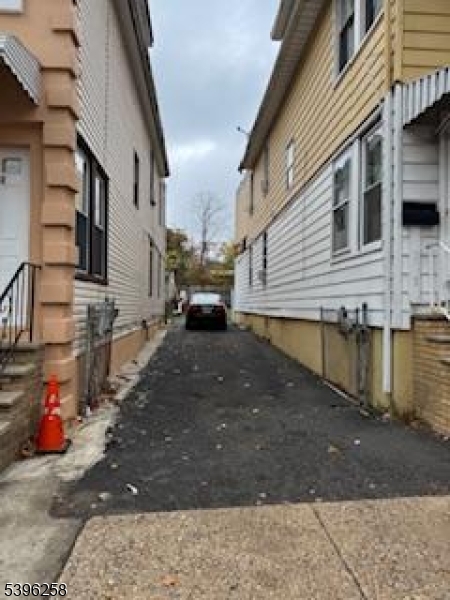 1414 Boa Place, Unit 2 Hillside, NJ 07205 - Photo 2 of 2 a view of street with parked cars
