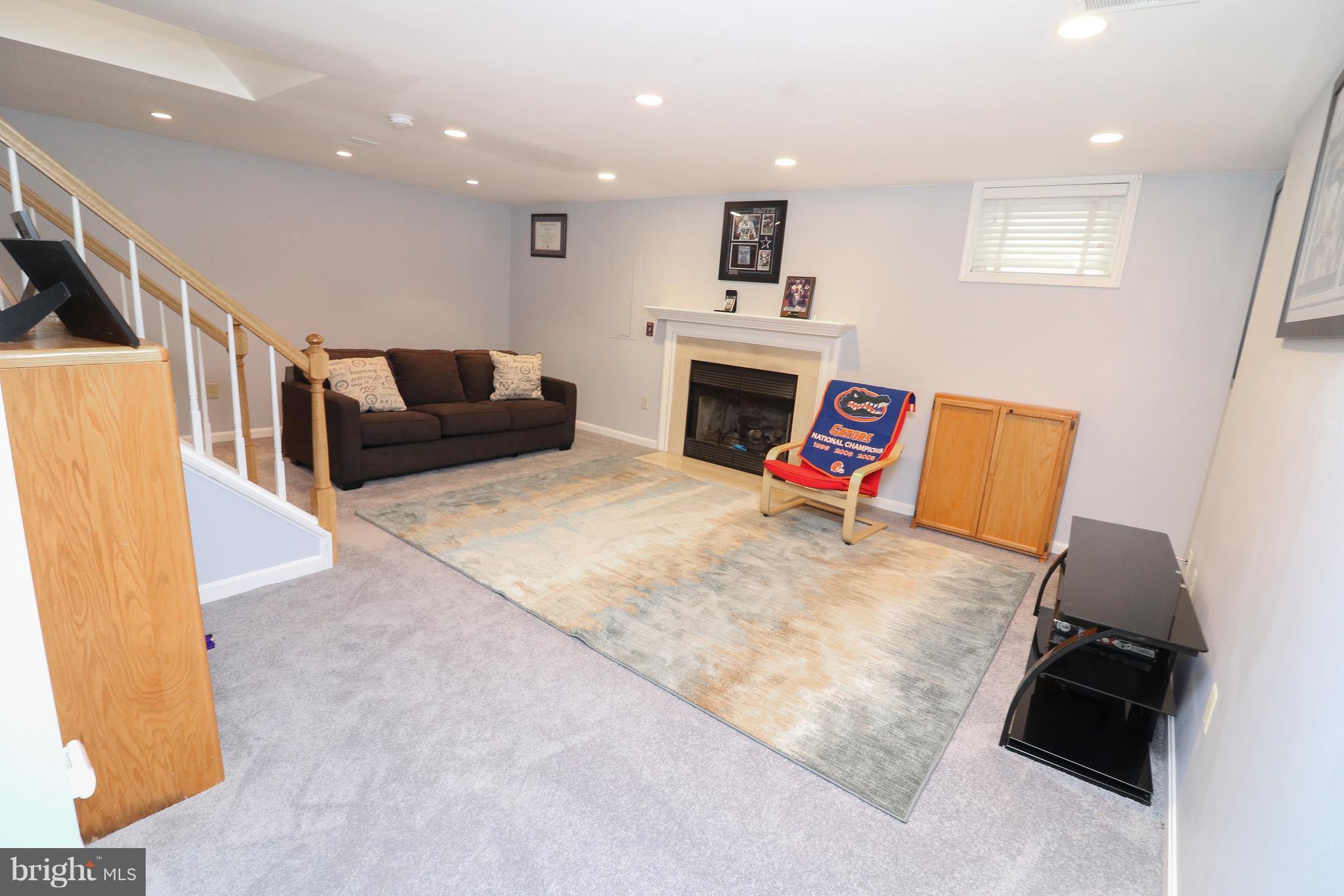 7281 Olde Lantern Way Springfield, VA 22152 - Photo 22 of 30 Lower Level Recreation Room with Gas FP