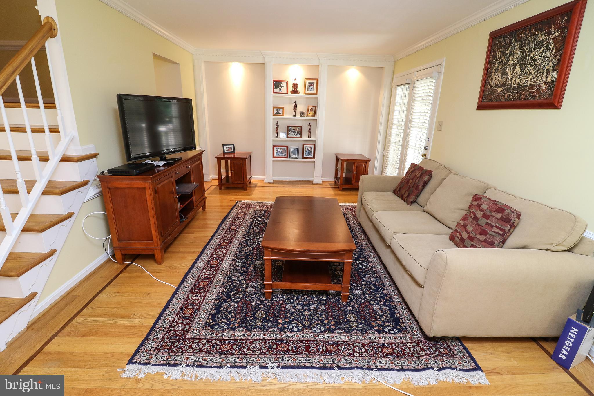 7281 Olde Lantern Way Springfield, VA 22152 - Photo 9 of 30 Living Room with Built-In Book Shelves