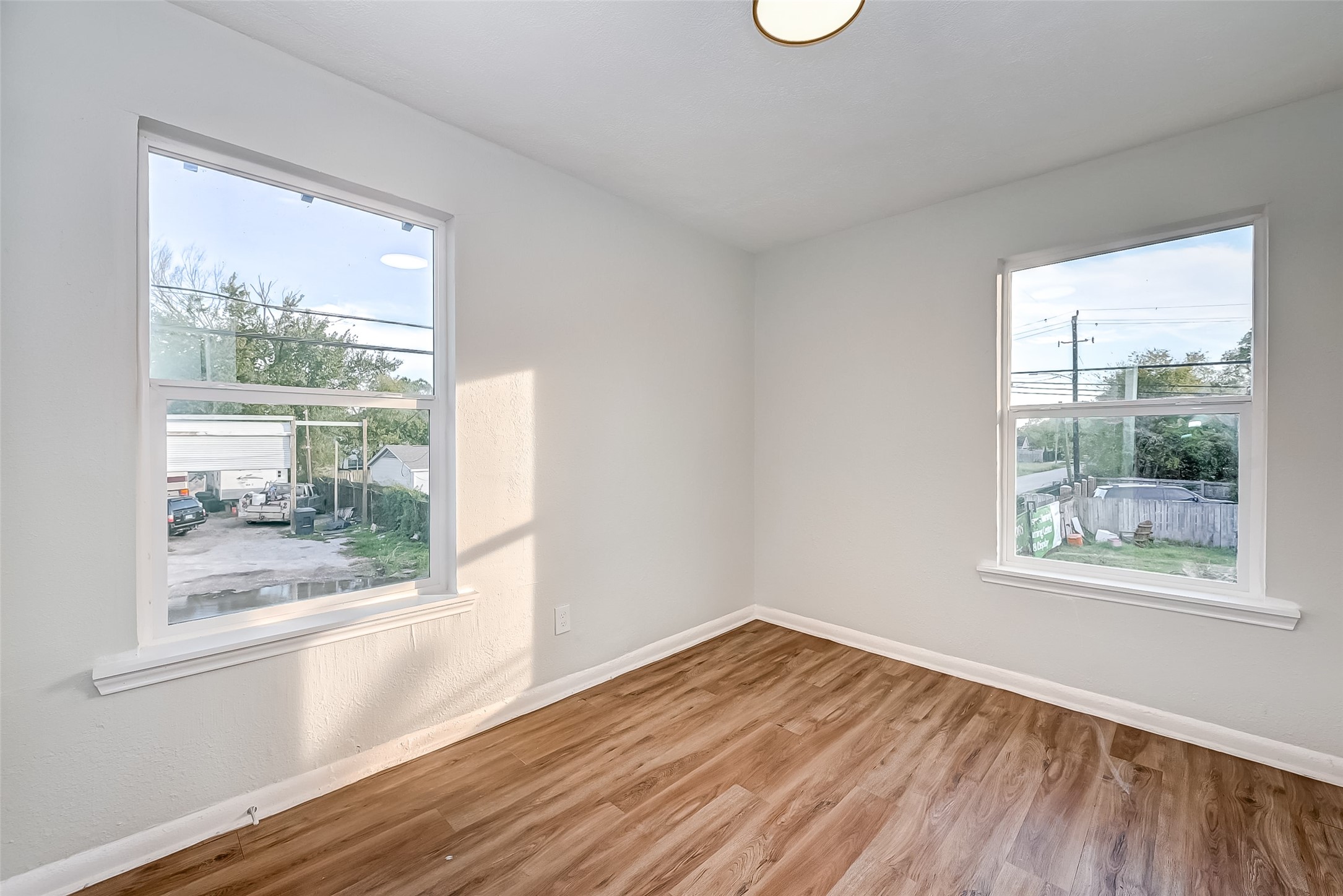 6420 Conley Street, Unit 3 Houston, TX 77021 - Photo 6 of 10 a view of empty room with wooden floor and fan