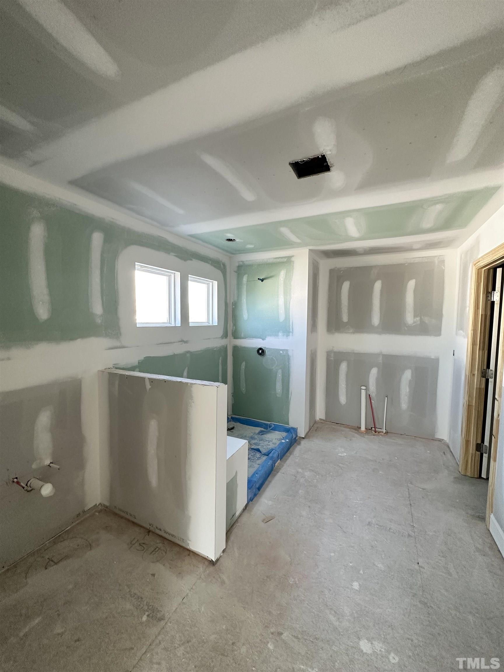 4404 Beckel Road Willow Spring, NC 27592 - Photo 8 of 10 an empty room with windows