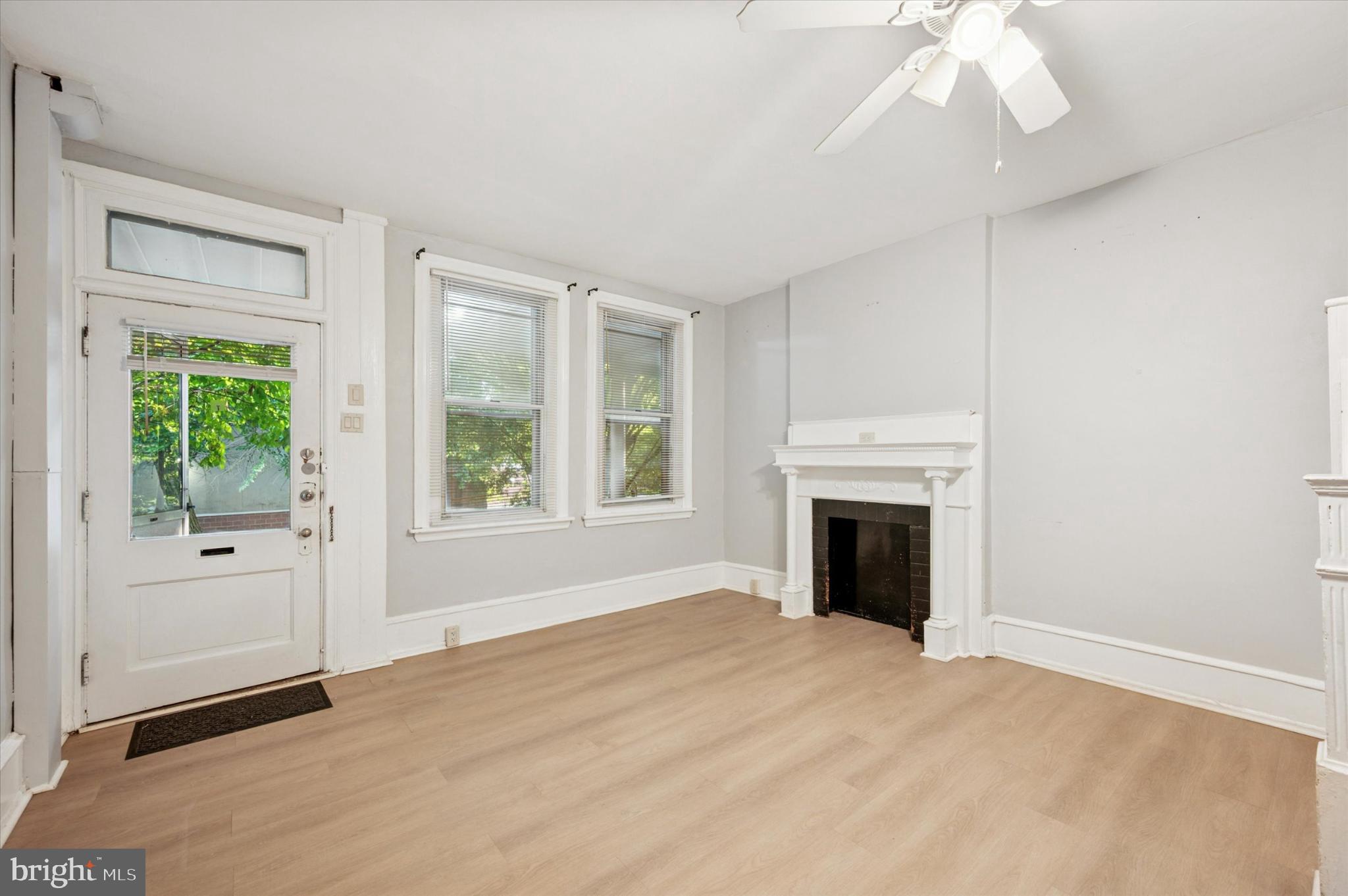 4817 Ridge Avenue Philadelphia, PA 19129 - Photo 18 of 34 an empty room with windows and fireplace