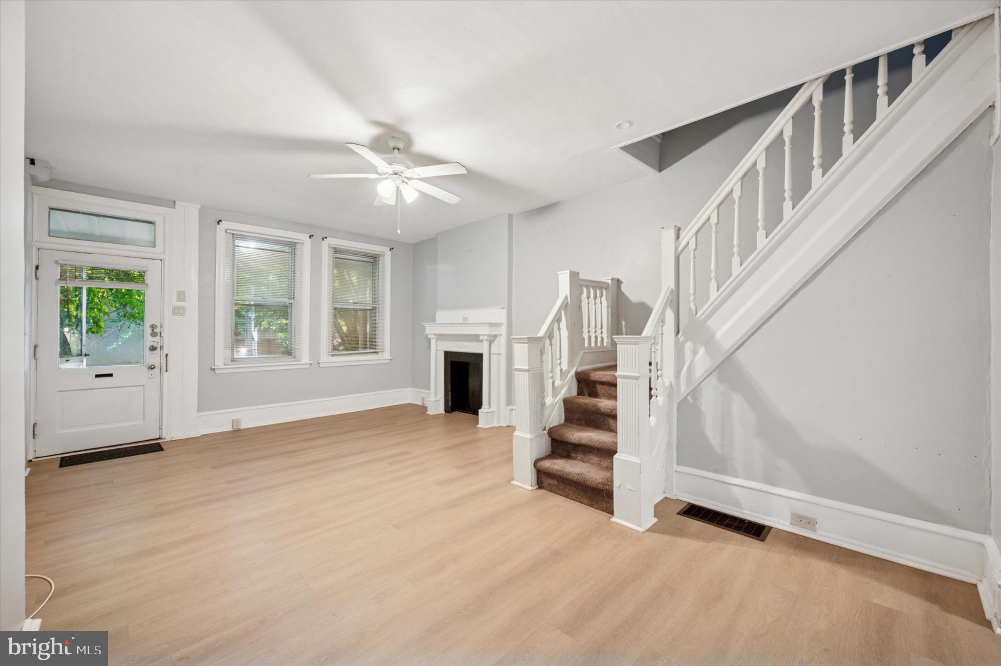 4817 Ridge Avenue Philadelphia, PA 19129 - Photo 19 of 34 an empty room with windows and fireplace