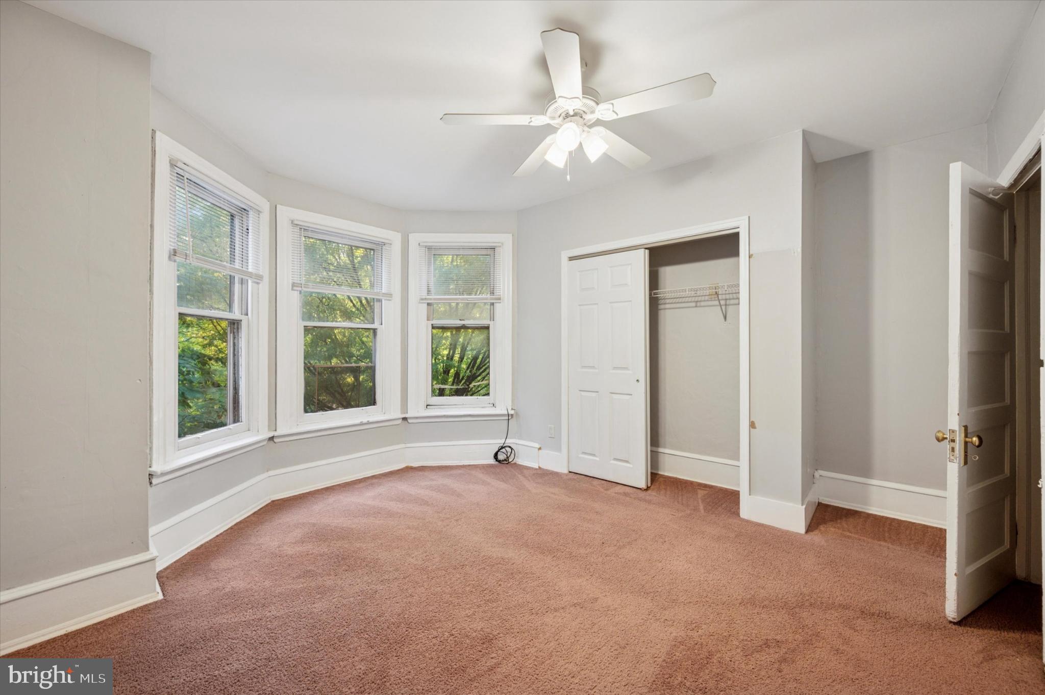 4817 Ridge Avenue Philadelphia, PA 19129 - Photo 25 of 34 an empty room with windows and fan