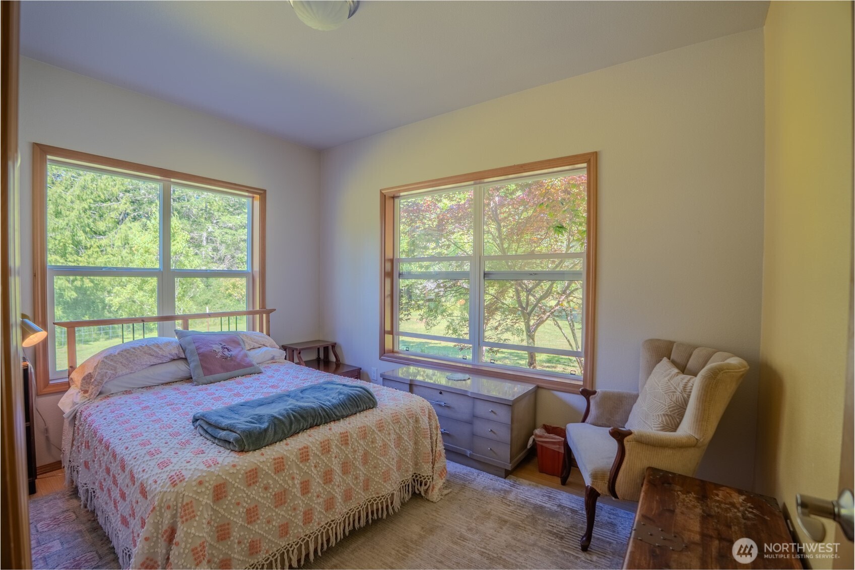 5178 Orcas Road Orcas Island, WA 98245 - Photo 12 of 37 a bedroom with a bed and a chair