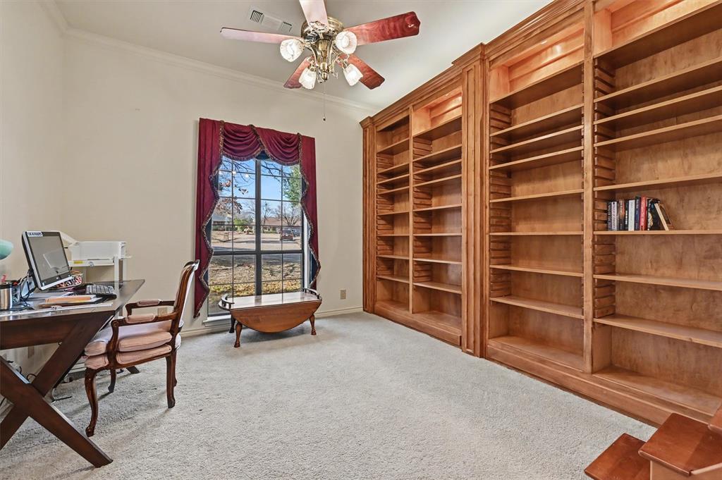 304 Trollinger Street Whitesboro, TX 76273 - Photo 21 of 25 a view of a livingroom with workspace and a window