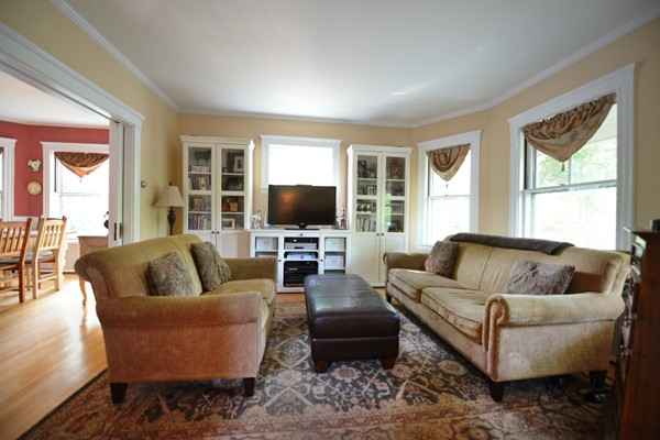 185 Weston Road Wellesley, MA 02482 - Photo 3 of 11 a living room with furniture and a flat screen tv