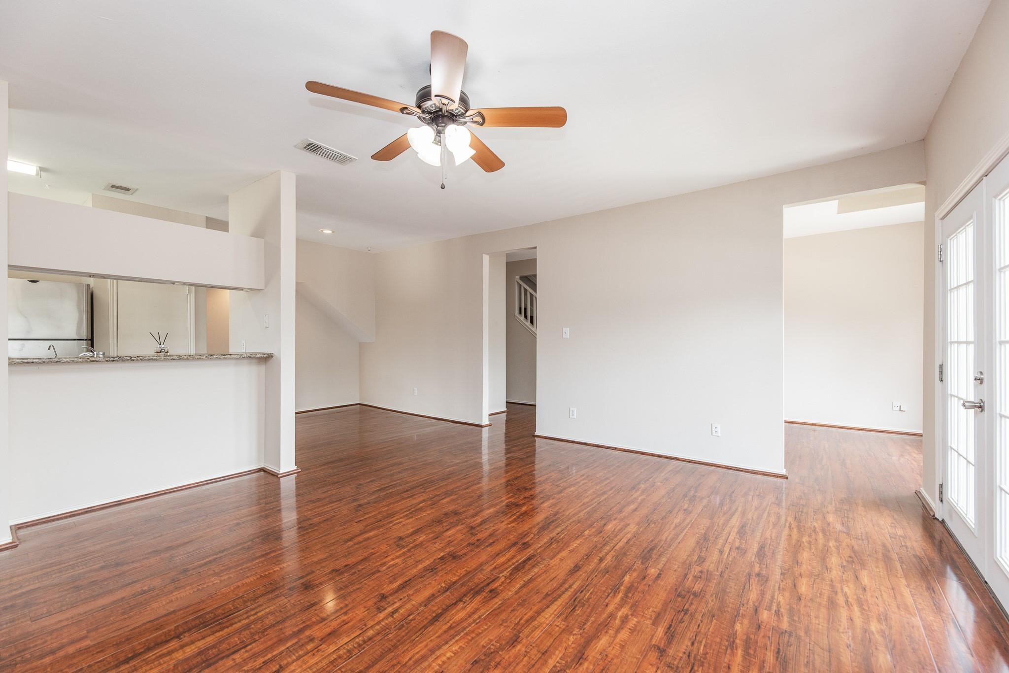 2023 Gentryside Drive, Unit 508 Houston, TX 77077 - Photo 14 of 41 a view of empty room with wooden floor and ceiling fan