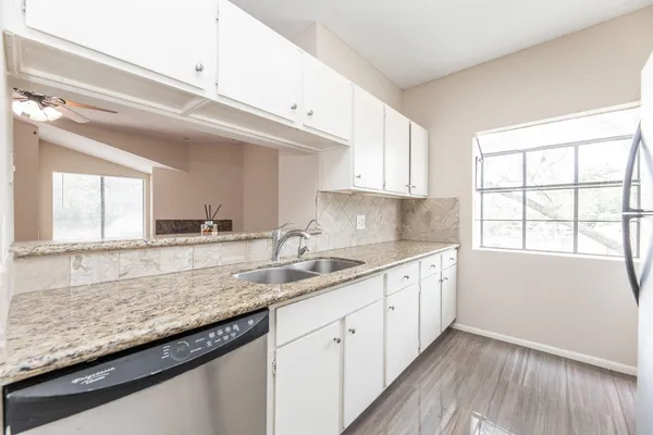a kitchen with a stove and a microwave