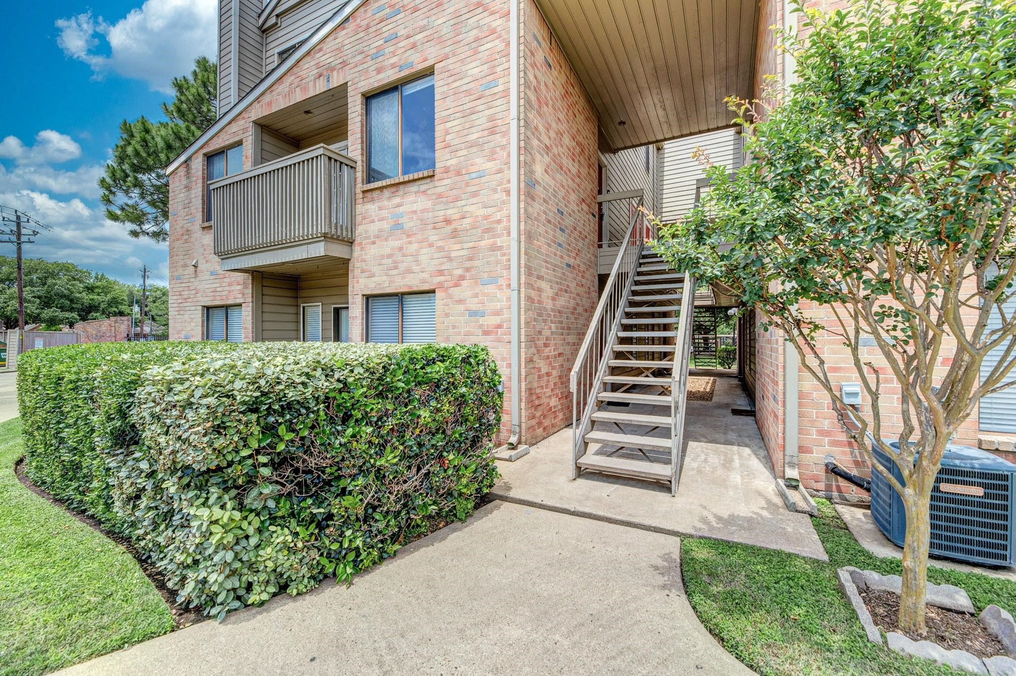 2023 Gentryside Drive, Unit 508 Houston, TX 77077 - Photo 3 of 41 a front view of a house with a yard