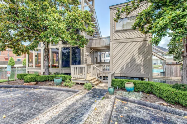 a view of a house with swimming pool and sitting area