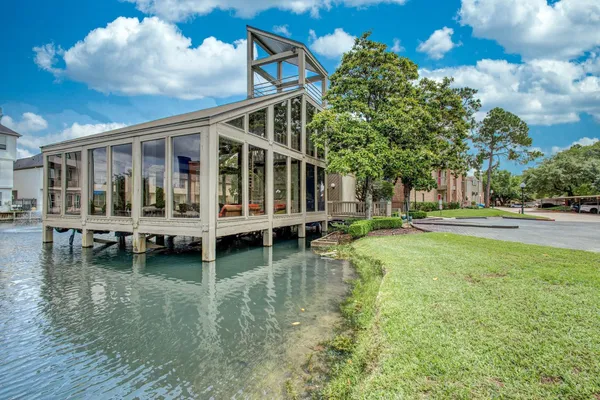 a view of a patio with swimming pool