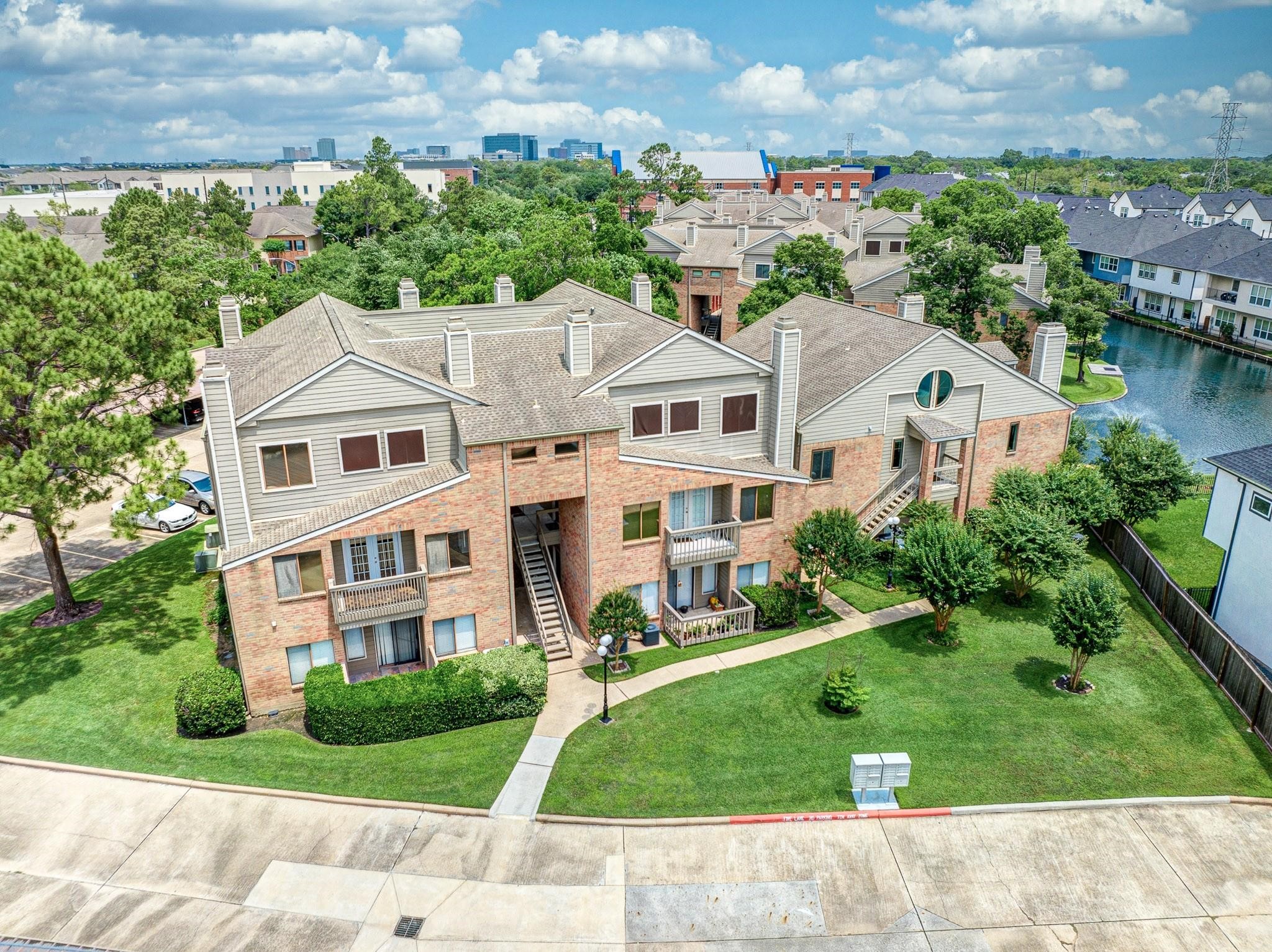 2023 Gentryside Drive, Unit 508 Houston, TX 77077 - Photo 5 of 41 an aerial view of residential houses with yard and green space