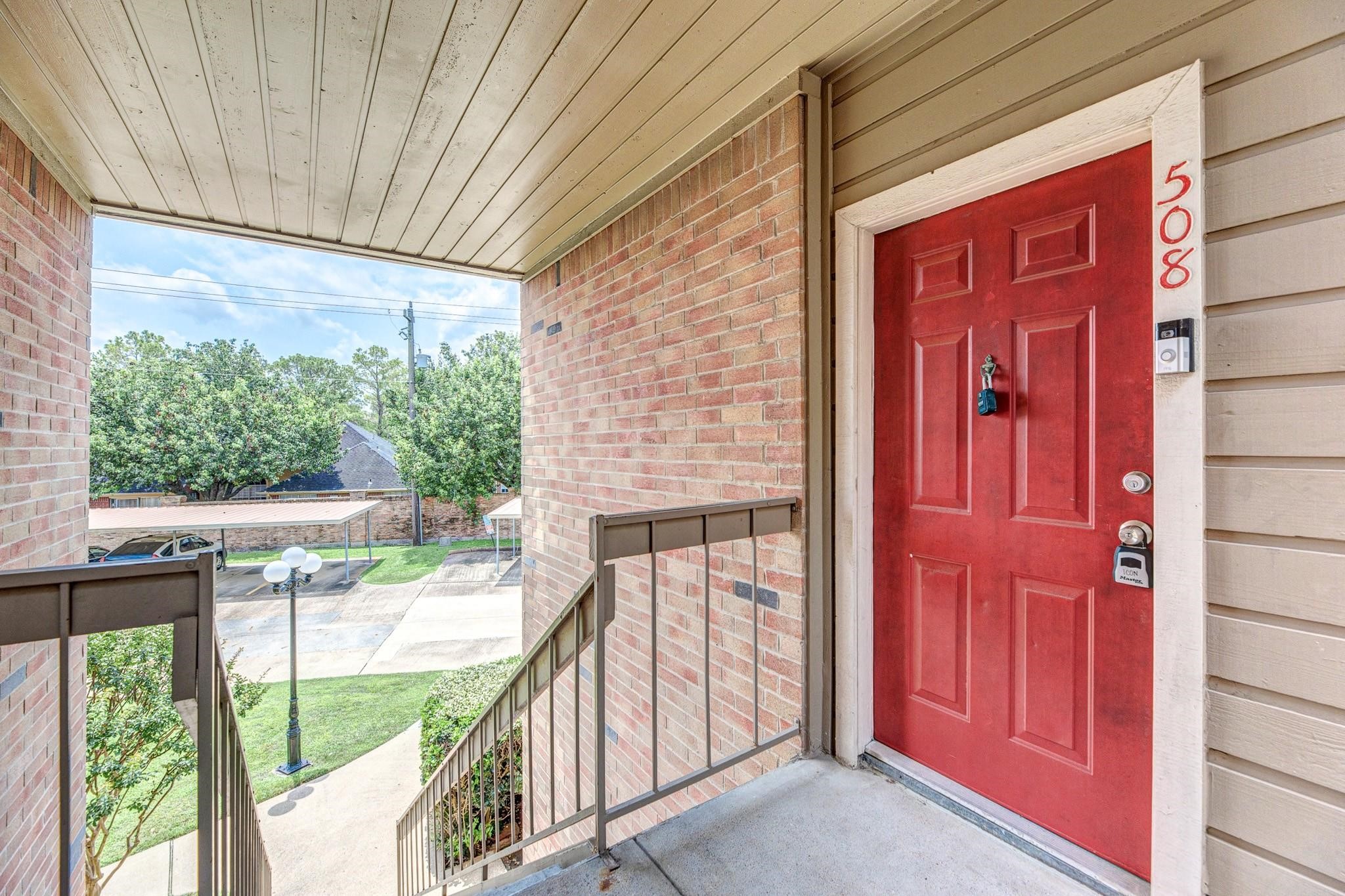 2023 Gentryside Drive, Unit 508 Houston, TX 77077 - Photo 8 of 41 a view of a porch with a table and chairs
