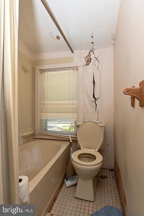 313 Sassafras Street Millville, NJ 08332 - Photo 22 of 25 a bathroom with a toilet and a shower