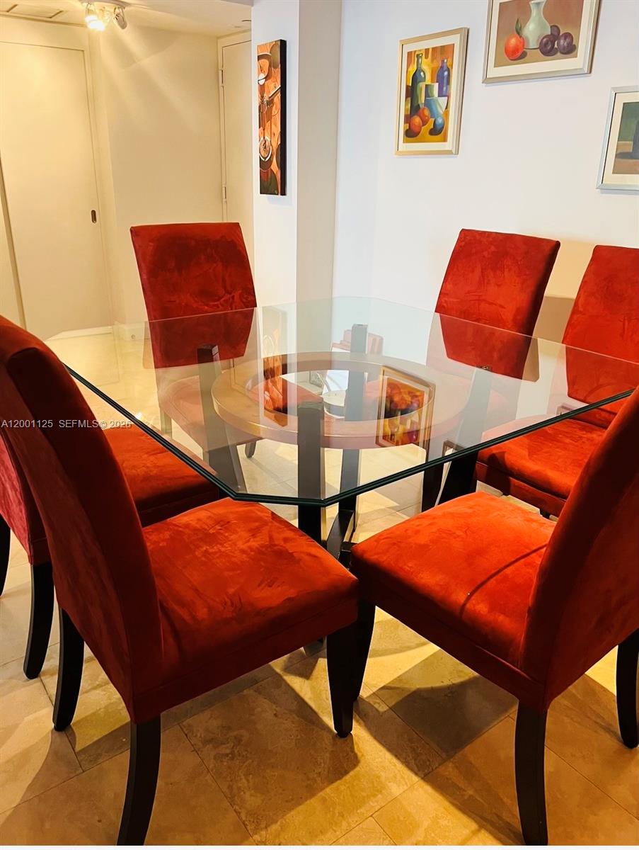 2333 Brickell Avenue, Unit 1803 Miami, FL 33129 - Photo 18 of 23 a blue and white room with chairs