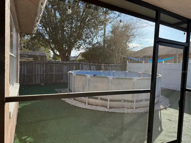 a view of backyard with green space