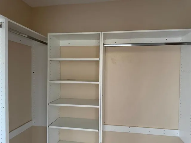 a view of an empty walk in closet