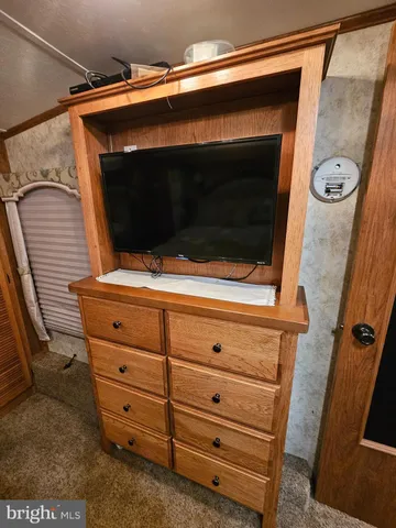 a view of a patio with table and chairs