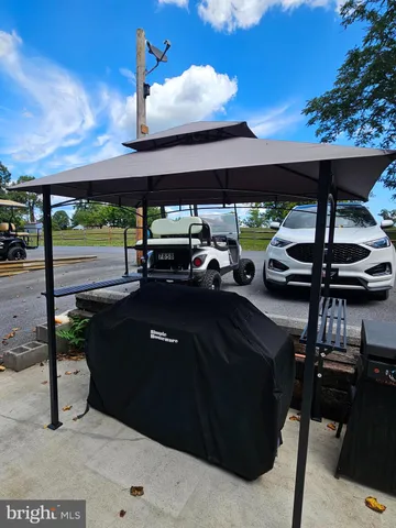 a view of a backyard with trampoline