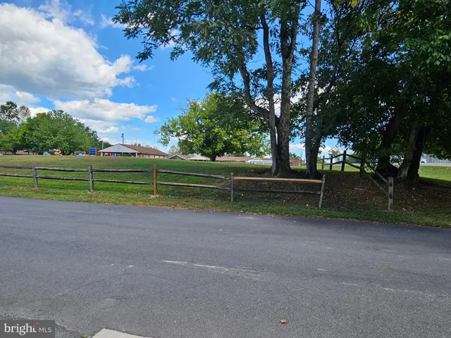 a view of a house and a yard