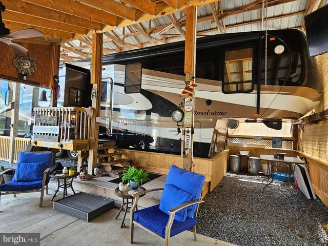 a view of outdoor space with dining table and chairs