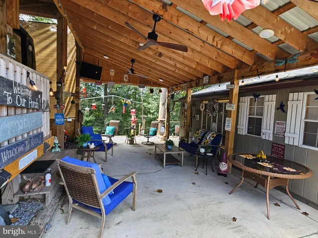 a view of a chairs and table in the patio