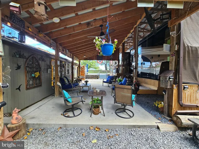 an outdoor sitting area with furniture