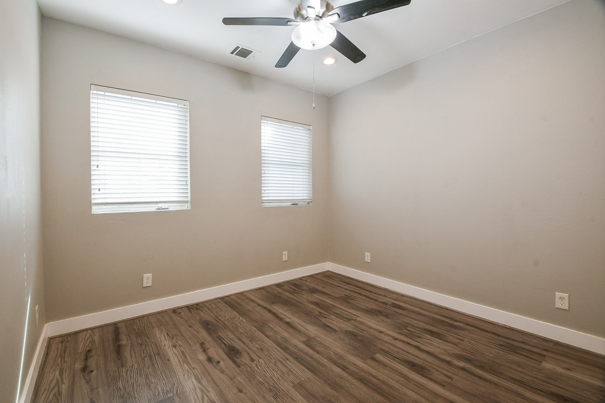 3249 Dixie Drive, Unit B Houston, TX 77021 - Photo 15 of 25 wooden floor in an empty room with a window
