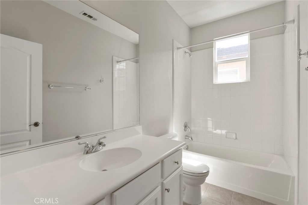 63 Figtree Irvine, CA 92603 - Photo 13 of 14 a bathroom with a sink toilet tub and shower