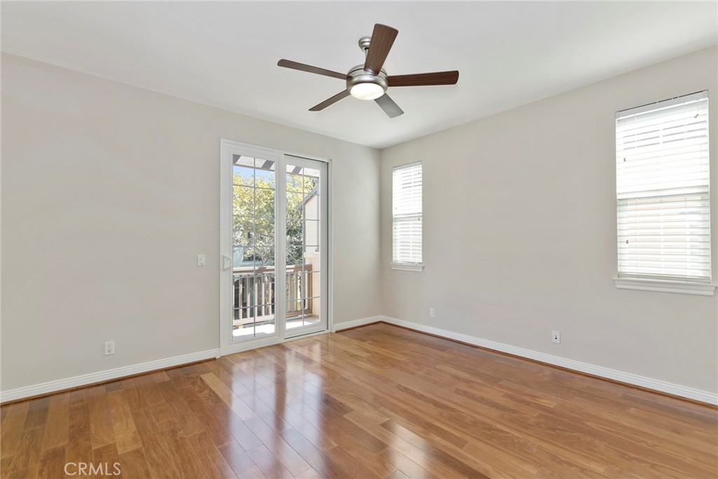 63 Figtree Irvine, CA 92603 - Photo 9 of 14 a view of an empty room with wooden floor and a window