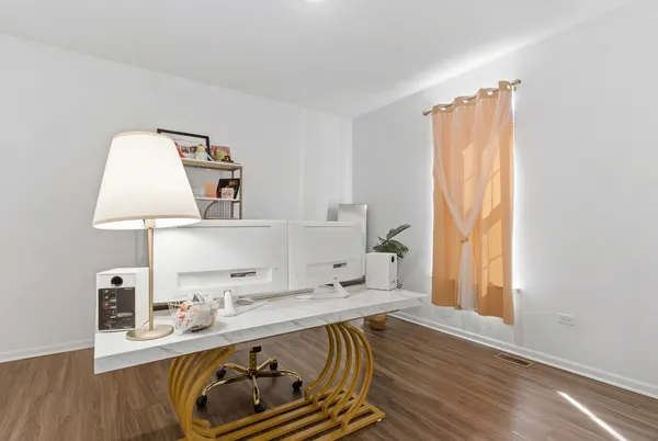 a view of a workspace with furniture