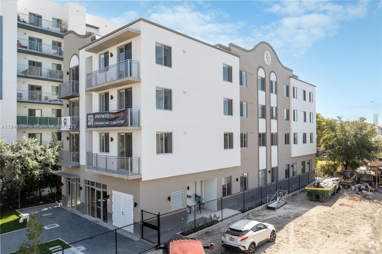 650 Southwest 1st Street, Unit 203 Miami, FL 33130 - Photo 1 of 15 a view of a building with many windows