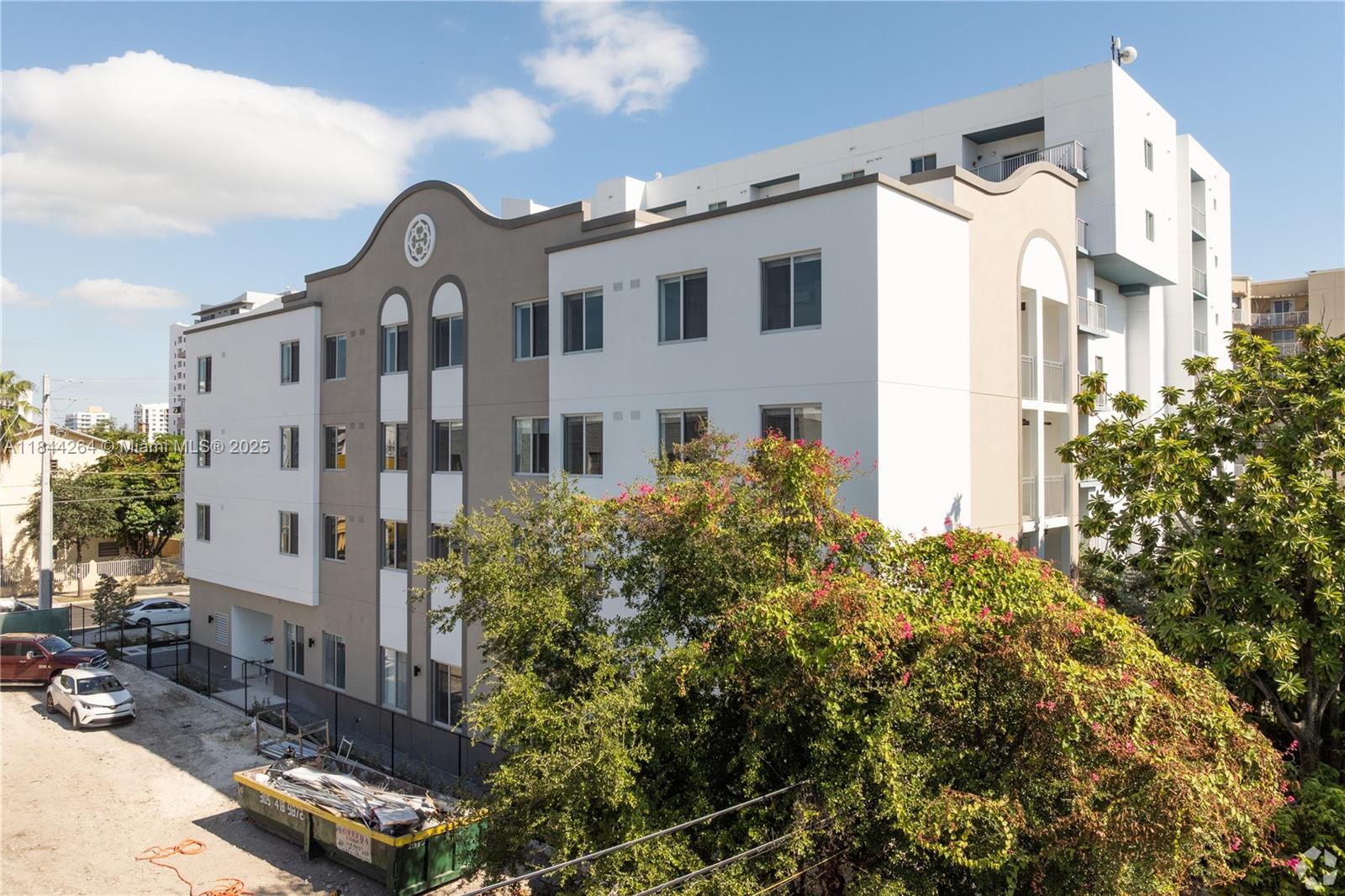 650 Southwest 1st Street, Unit 203 Miami, FL 33130 - Photo 14 of 15 a front view of a building with a garden
