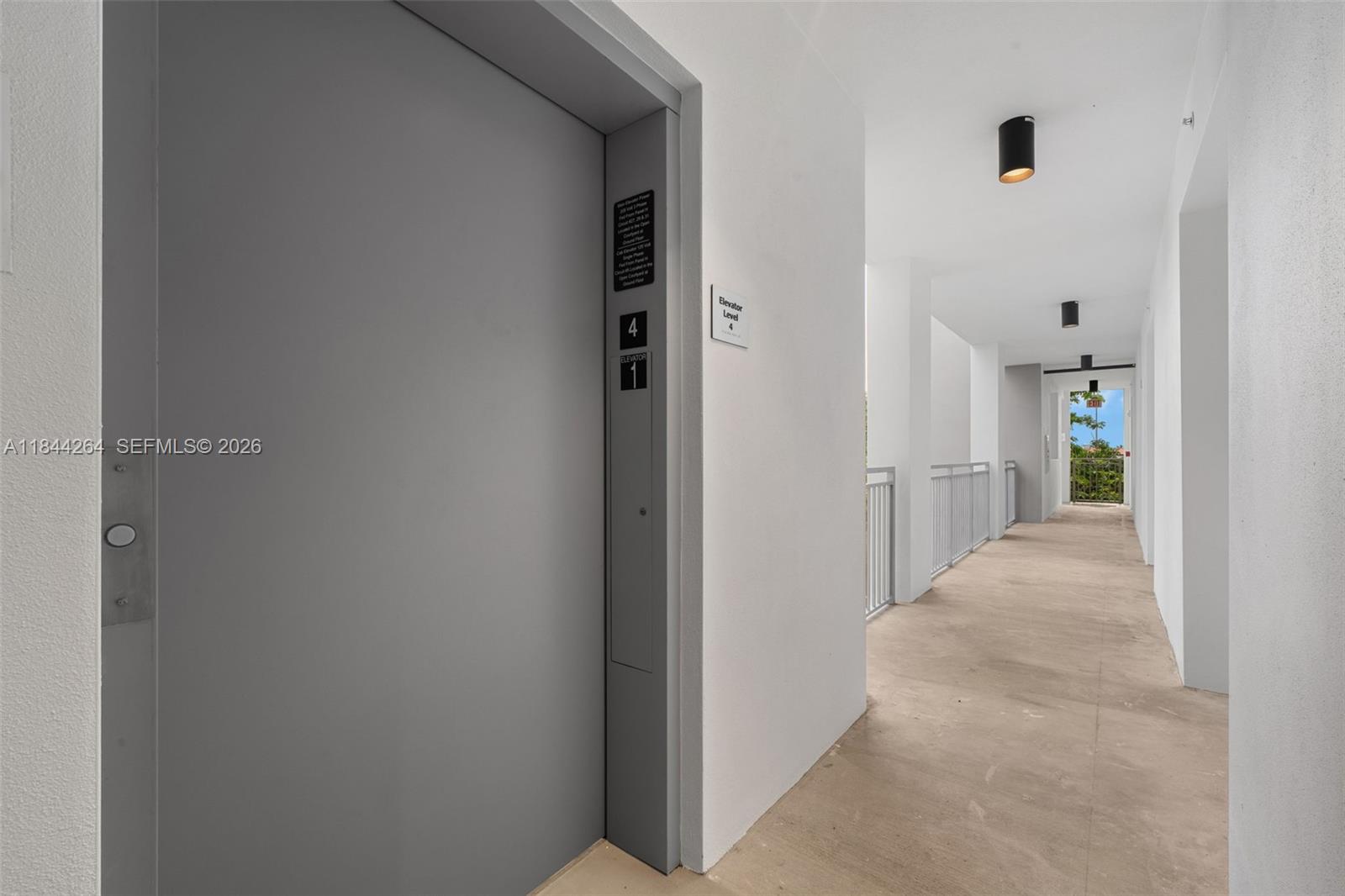 650 Southwest 1st Street, Unit 204 Miami, FL 33130 - Photo 19 of 25 a view of a hallway with wooden shelves