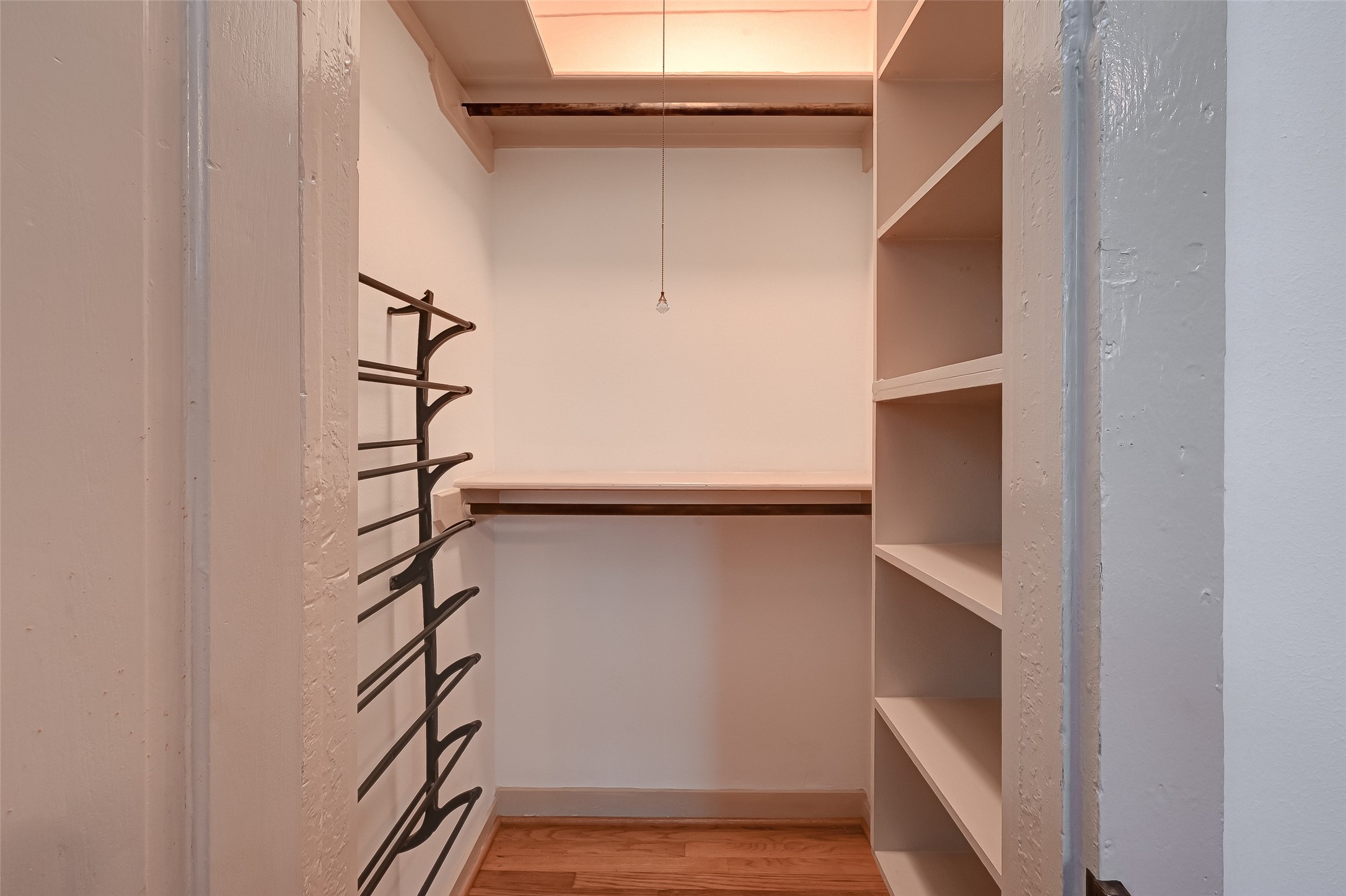 2009 State Street Houston, TX 77007 - Photo 29 of 42 Second bedroom closet space has poled clothing racks, shelving and a show rack