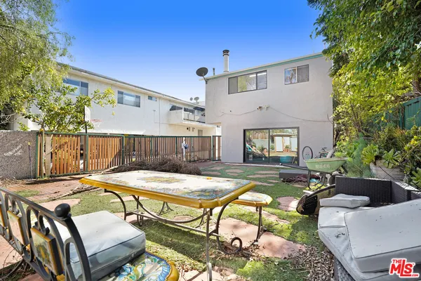 a view of a patio with swimming pool