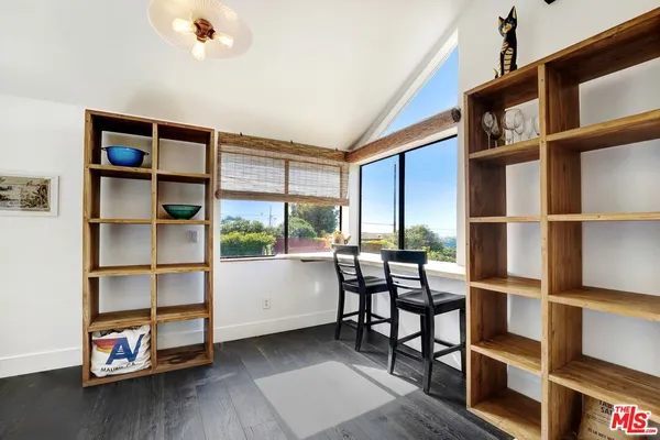 a view of a livingroom with furniture and window